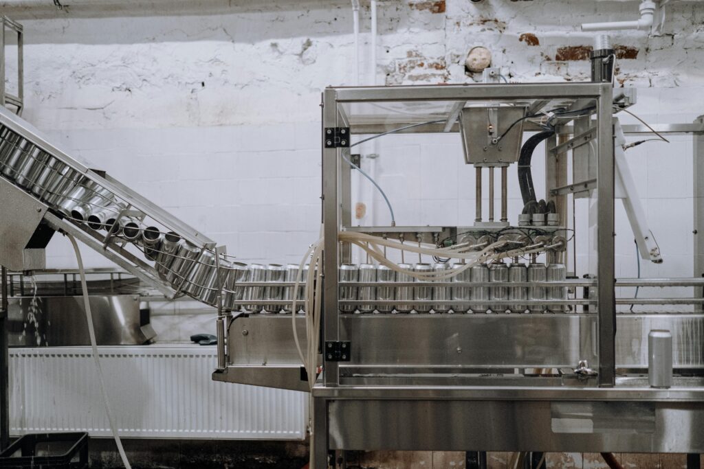 project-4 Automated beverage can packaging in a modern factory setting.